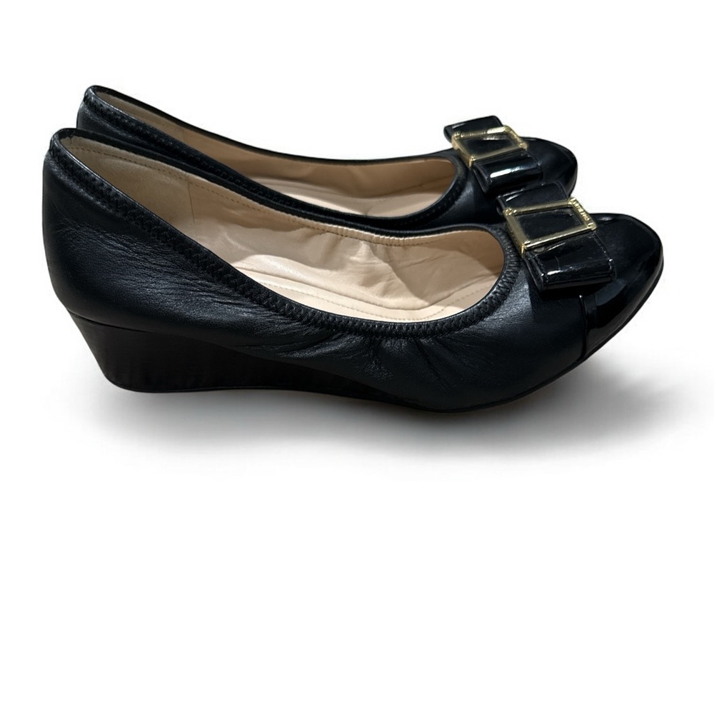 Cole Haan Black Leather Wedge Heel with Bow and Gold Hardware. Women’s size 6.